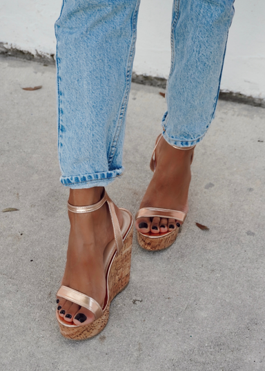 Women's rose gold cork wedge.